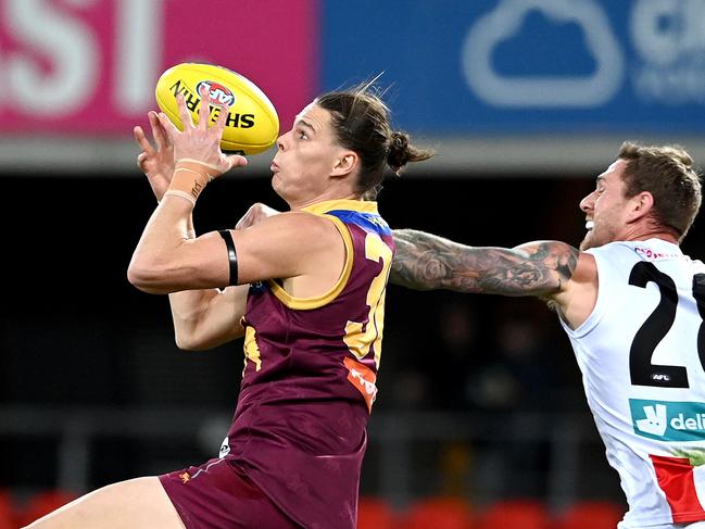 Eric Hipwood (left) attempts to grab a mark in his most recent AFL match 10 months ago. Picture: Bradley Kanaris/Getty Images