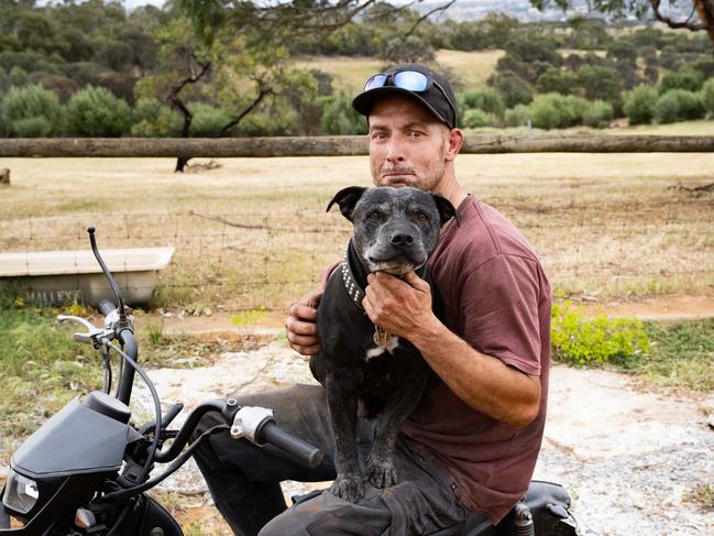 Justin Arthur, 35, with his dog Roter, owns of one of the properties affected by the now contained fire on Sheoak Rd, McLaren Vale, Wednesday, October 11, 2023. Picture: The Advertiser/ Morgan Sette