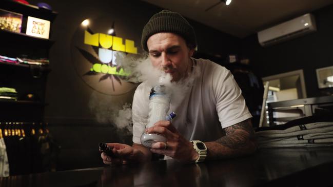 Chris Burn in the Mullup shop in Canberra with one of his most popular bongs, the Powerbeug, is in favour of the legislation. WARNING:- no illegal substance was used in the making of this photograph taken by Gary Ramage.