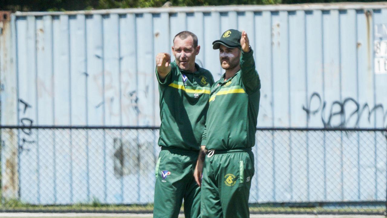 Spotswood works out their fielding plans. Picture: Valeriu Campan