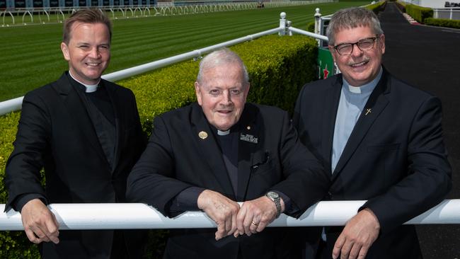 Brother Dan Stafford (centre) with his replacement father Thomas Stevens (left) and Reverend Colin Watts at Randwick Racecourse. Picture:Justin Lloyd.