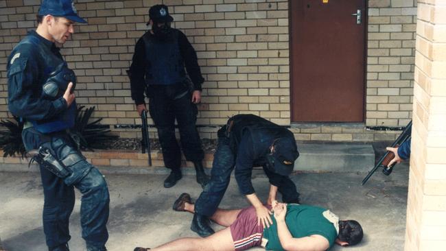 Gary Jubelin (left) during his younger years as a police officer.