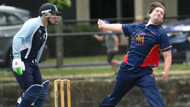 Mont Albert’s Andrew Padbury bends his back against Canterbury. Picture: Hamish Blair