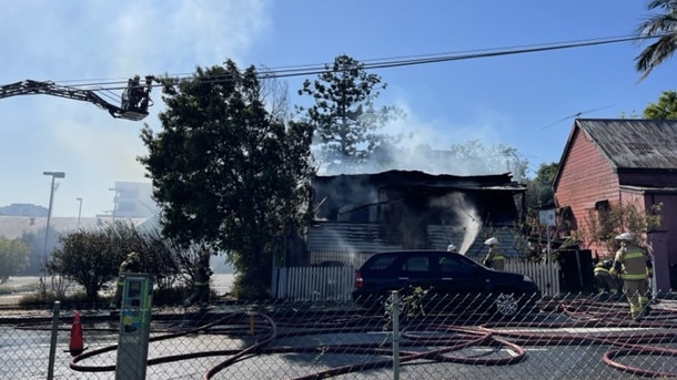 The house was engulfed by flames when firefighters arrived.