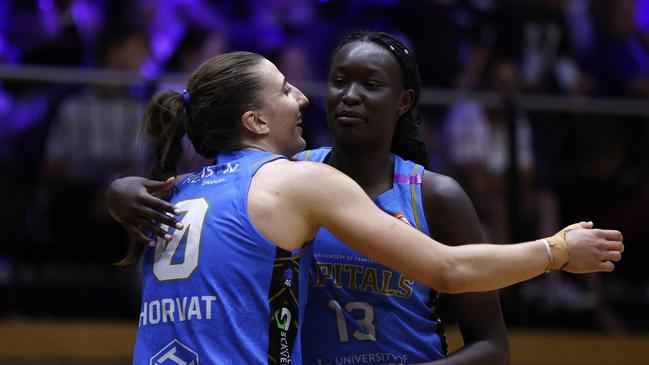 Chantel Horvat (left) celebrates a win in Geelong with Capitals teammate Nyadiew Puoch. Picture: Darrian Traynor/Getty Images