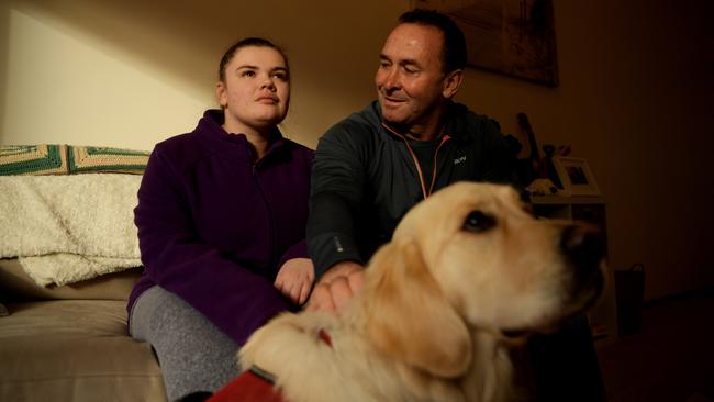 Ricky Stuart with Emma and her companion dog, Cosmo. Picture: AAPImage/Tracey Nearmy