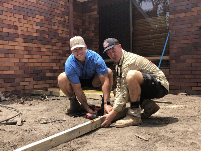Jarrod Wallace (left) on the site with Red Dog Landscaping. Picture: Gold Coast Titans