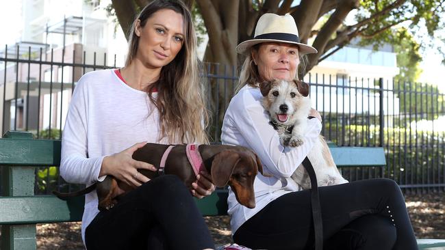 Jacqueline Parish with Tilly and Kathryn Downey with Archie at New Farm Park yesterday. Picture: Richard Gosling/AAP