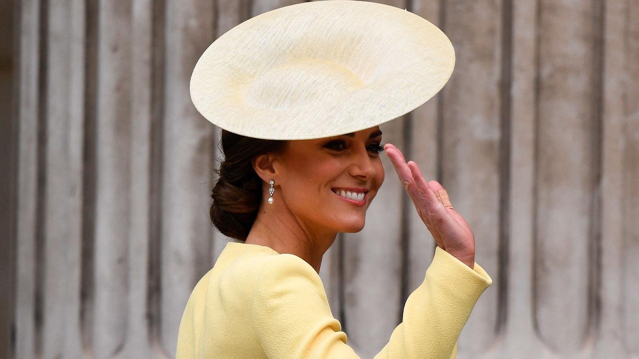 Kate looked stunning in yellow as she arrived. Picture: TOBY MELVILLE / POOL / AFP