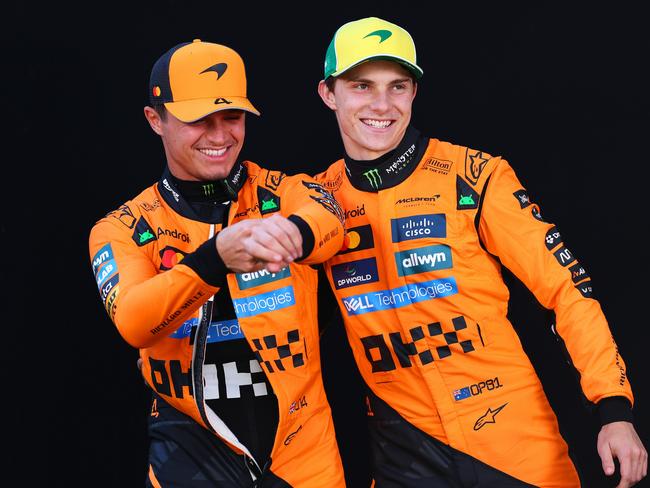 MELBOURNE, AUSTRALIA - MARCH 13: Lando Norris of Great Britain and McLaren and Oscar Piastri of Australia and McLaren looks on during previews ahead of the F1 Grand Prix of Australia at Albert Park Grand Prix Circuit on March 13, 2025 in Melbourne, Australia. (Photo by Clive Rose/Getty Images)