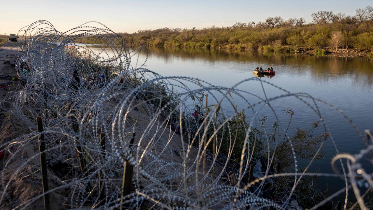 US National Guard soldiers patrol the Rio Grande at the US – Mexico border where Texan Governor Greg Abbot has authorised setting up border wire. Picture: John Moore/Getty Images/AFP