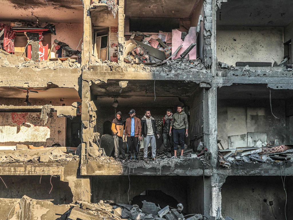 Palestinians check a half-destroyed building following Israeli bombardment on Rafah, in the southern Gaza Strip. Picture: Said Khatib/AFP