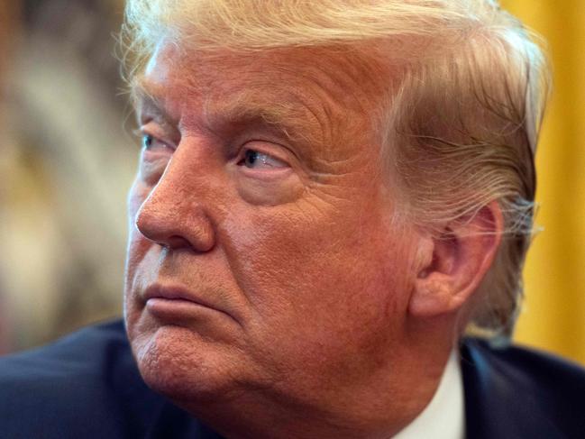 US President Donald Trump listens in the Oval Office of the White House in Washington, DC, on September 11, 2020. - Trump announced Friday a "peace deal" between Israel and Bahrain, which becomes the second Arab country to settle with its former foe in the last few weeks. (Photo by ANDREW CABALLERO-REYNOLDS / AFP)