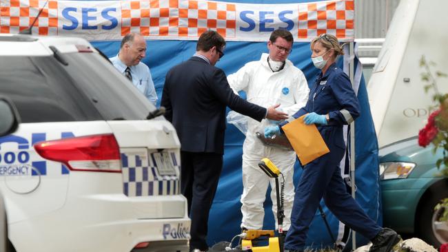 Forensic evidence is collected from the scene of the death. Picture: Alison Wynd