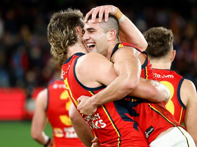 Riley Thilthorpe and Josh Rachele after a Crows win. Picture: Michael Willson/AFL Photos via Getty Images