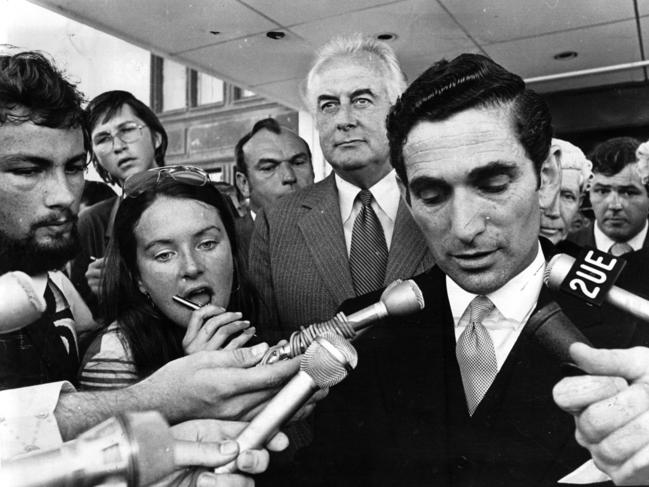 The moment of the Dismissal. Prime Minister Gough Whitlam stands to listen to the Governor-General’s proclamation. Picture: News Corp Australia