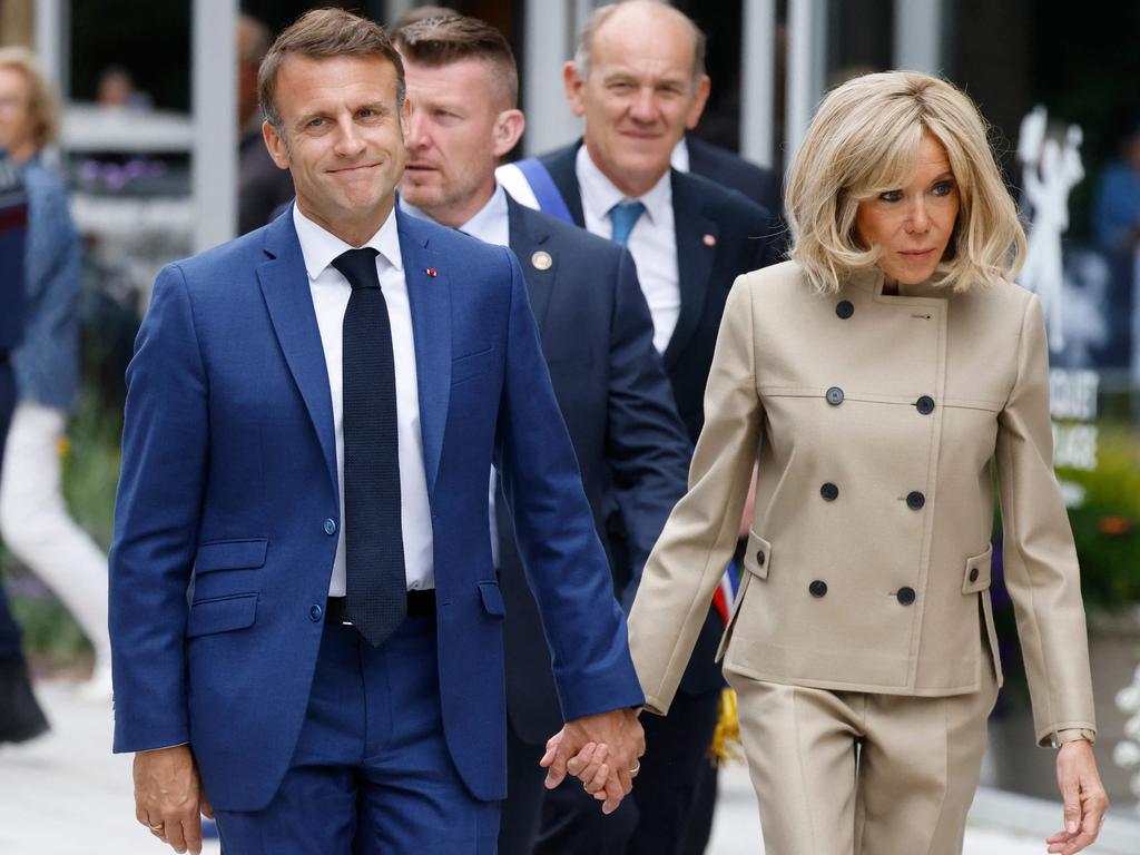 French President Emmanuel Macron (L) and his wife Brigitte Macron (R) leave the pooling station after voting in the first round of parliamentary elections. Picture: AFP