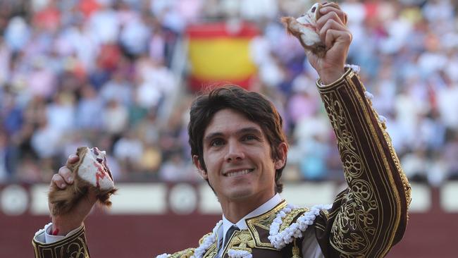 French matador (bullfighter) Sebastian Castella smiles as he shows his bull's ears last week in Madrid. Picture: Alberto Simon