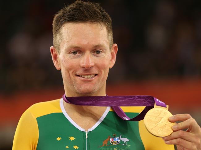 LONDON, ENGLAND - SEPTEMBER 01: Gold medalist Michael Gallagher of Australia pose on the podium during the medal ceremony in the Men's Individual C5 Pursuit Final on day 3 of the London 2012 Paralympic Games at Velodrome on September 1, 2012 in London, England. (Photo by Bryn Lennon/Getty Images)