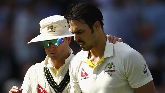 Australian captain Michael Clarke consoles fast bowler Mitchell Johnson during the Fourth Test of the 2015 Ashes. The treatment Johnson received from the Barmy Army bordered on bullying. Picture: Ryan Pierse/Getty Images