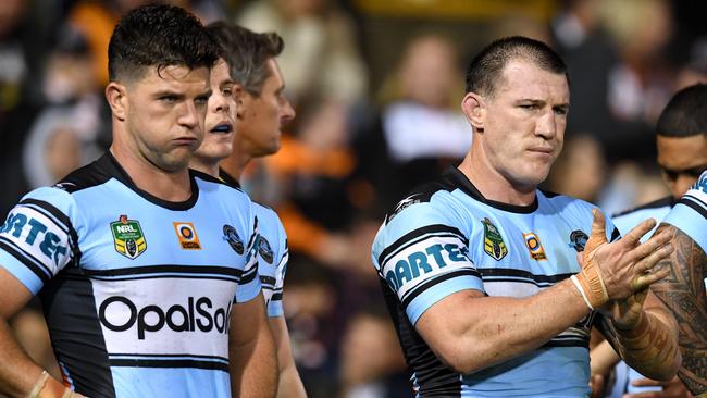 (l to R) Chad Townsend, Paul Gallen and Andrew Fifita of the Sharks look on following a try scored by Kevin Naiqama of the Tigers during the round 9 NRL match between the West Tigers and the Cronulla Sutherland Sharks at Leichhardt Oval in Sydney on Saturday, April 29, 2017. (AAP Image/Paul Miller) NO ARCHIVING, EDITORIAL USE ONLY