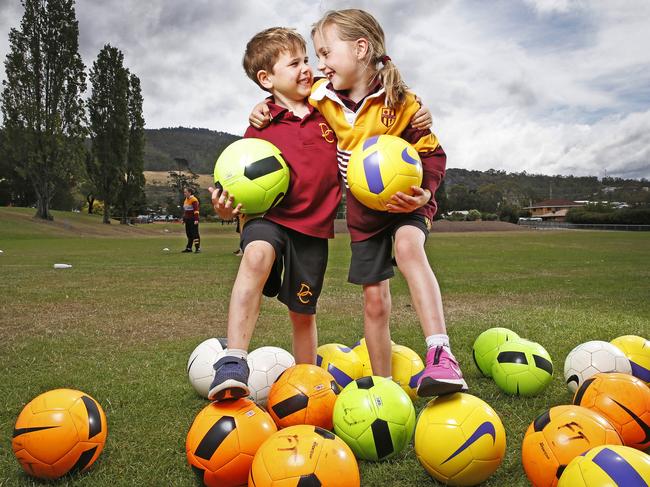 Dominic College grade 1 students Jameson King, 6 of Montrose and Charlotte Berry of Glenlusk ahead of the Football Tasmania release the State of Play report. Picture: ZAK SIMMONDS