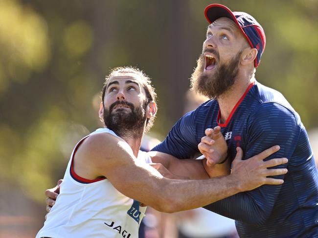 MELBOURNE, AUSTRALIA - MARCH 17: Brodie Grundy and Max Gawn of the Demons compete in the ruck during a Melbourne Demons AFL training session at Gosch's Paddock on March 17, 2023 in Melbourne, Australia. (Photo by Morgan Hancock/Getty Images)