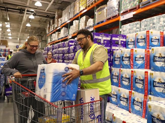 PERTH, AUSTRALIA - MARCH 19: Staff members assist shoppers at Costco Perth on March 19, 2020 in Perth, Australia. The store, which is the first Costco in Western Australia, is limiting toilet paper purchases to one packet per customer, in response to panic buying across Australia as fears over the COVID-19 pandemic grow. There are 596 confirmed cases of COVID-19 In Australia and 20 confirmed deaths,. (Photo by Paul Kane/Getty Images)