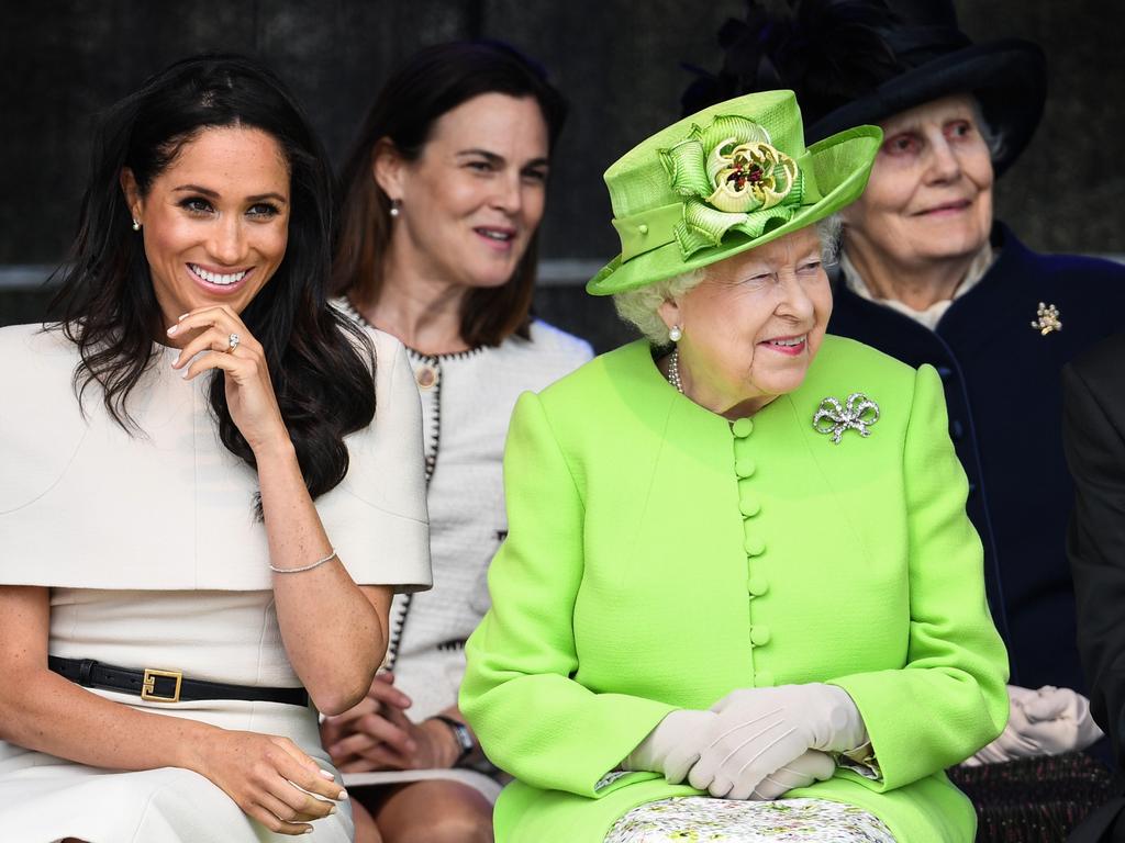Queen Elizabeth II sits with Meghan, Duchess of Sussex accompanied by Samantha Cohen (Back, C) during a ceremony on June 14, 2018. Picture: Jeff J Mitchell