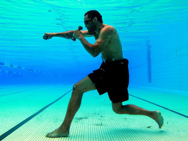 SUNDAY TELEGRAPH - Anthony Mundine trains underwater at Carss Park Swimming Pool before his IBF Middleweight world title fight against Daniel Geale.