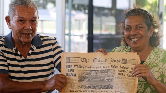 Lawrence and Susan Reys, the nephew and niece of Melbourne Cup winning jockey Frank Reys, with a copy of the Cairns Post the day after the famous rider won the race that stops the nation.