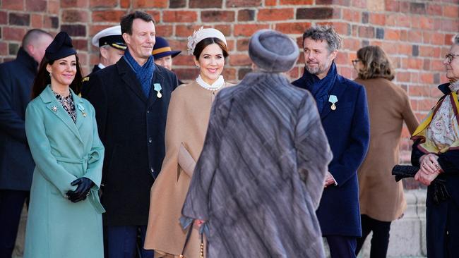 Queen Margrethe II of Denmark speaks to Princess Mary of Denmark. Picture: AFP.