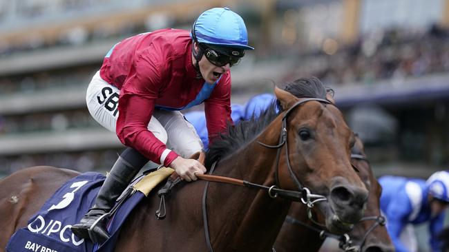 ASCOT, ENGLAND - OCTOBER 15: Richard Kingscote shouts as he rides Bay Bridge to win The Qipco Champion Stakes at Ascot Racecourse on October 15, 2022 in Ascot, England. (Photo by Alan Crowhurst/Getty Images)