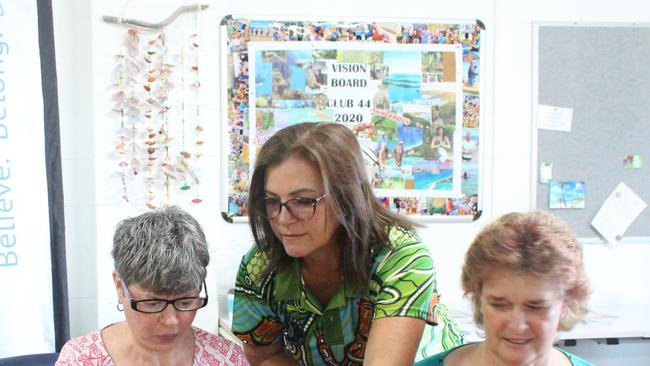 Sarina Amendolia, Bowen Flexi Care president and treasurer Julian Gaffney and Tracie Dignan try out iPads after scoring funding for new technology a previous round of the QCoal Foundation's grants. Photo: Contributed