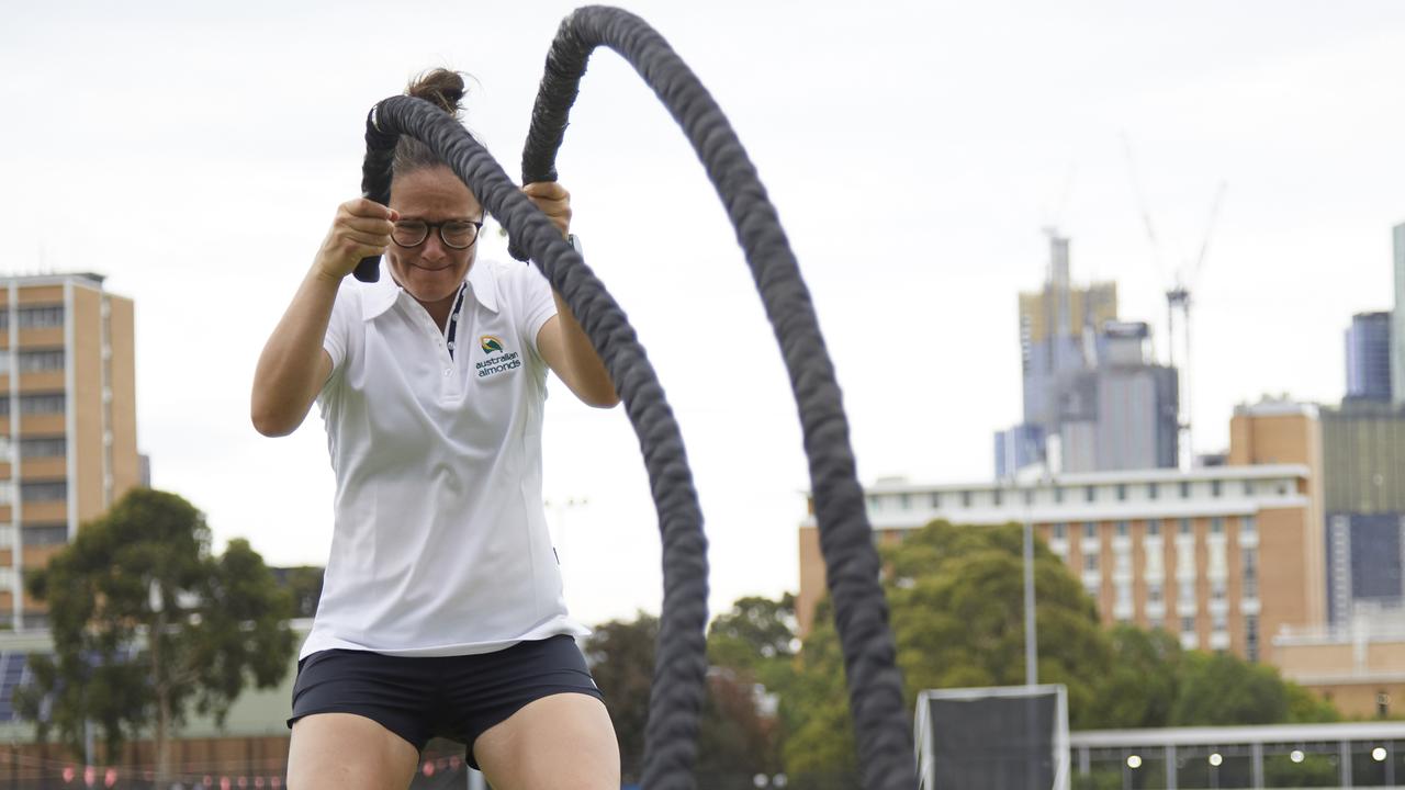 North Melbourne's AFLW captain Emma Kearney hard at work using the battle ropes.