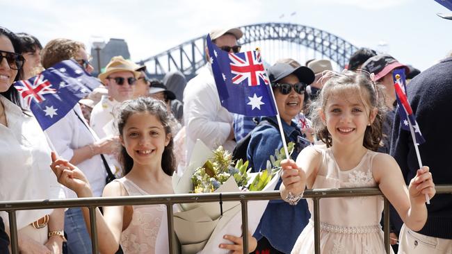 Royal fans Grace Wright and Charlotte Finn queue up to to see the King and Queen outside the Sydney Opera House. Picture: NewsWire / Damian Shaw