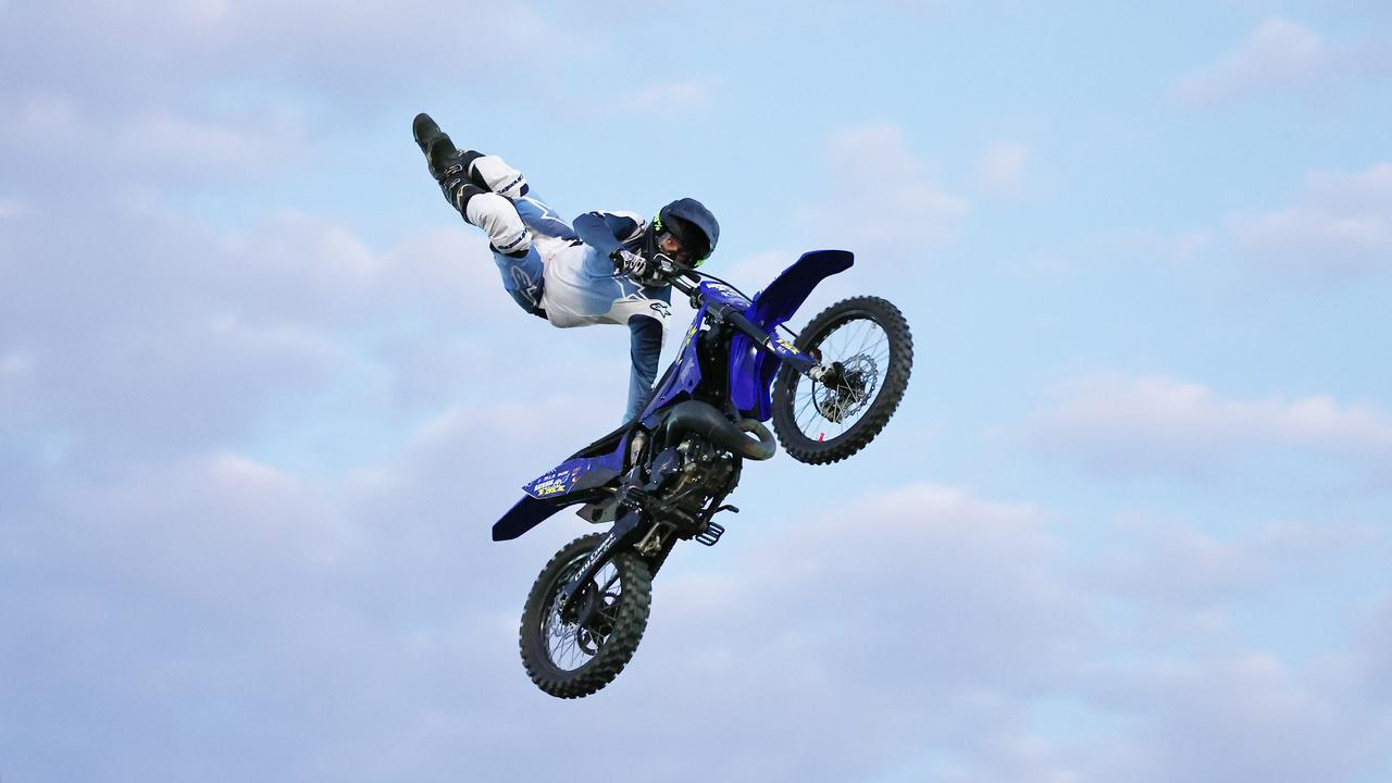 Tom Robertson gets both feet over his motocross bike at the 2024 Cairns Bull Throttle event, a bikes and bulls show, featuring bull riding and freestyle motocross riders at the Cairns Showgrounds. Picture: Brendan Radke