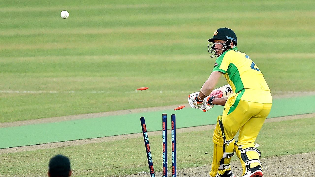 Australia's wicketkeeper Josh Philippe is clean bowled by Bangladesh's Mustafizur Rahman (not pictured) during the second Twenty20 international cricket match between Bangladesh and Australia at the Sher-e-Bangla National Cricket Stadium in Dhaka on August 4, 2021. (Photo by Munir Uz zaman / AFP)