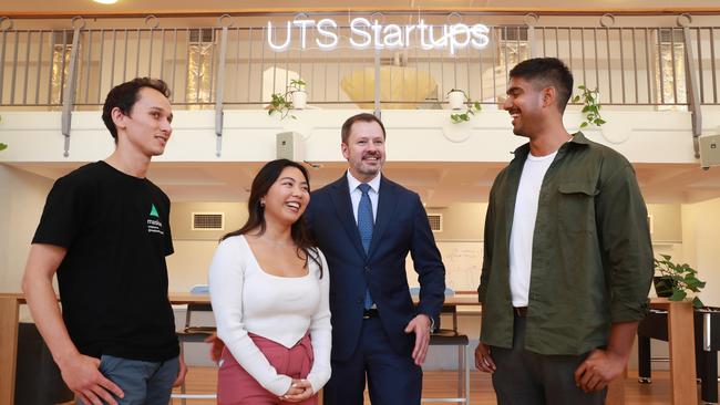 UTS students who are creating start up businesses, from left Andrew Akib, Denise Clemente and Dilhan Wickremanayake, with Industry and Science Minister Ed Husic at the UTS Startup centre. Photo: John Feder.