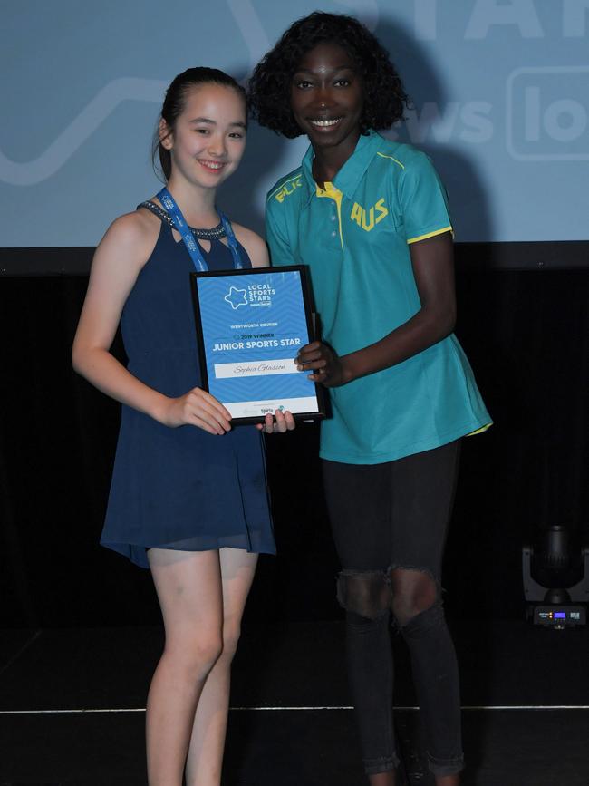 Sophia receiving her award from 2017 Junior Sports Star winner Bendere Oboya. Picture: Simon Bullard