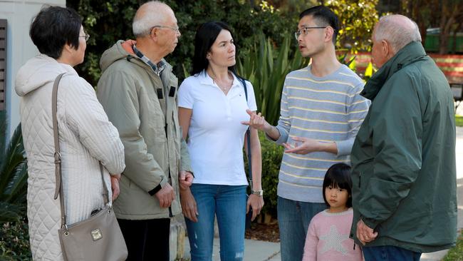 Clement Lun chats with residents at Sydney Olympic Park. Picture: Angelo Velardo