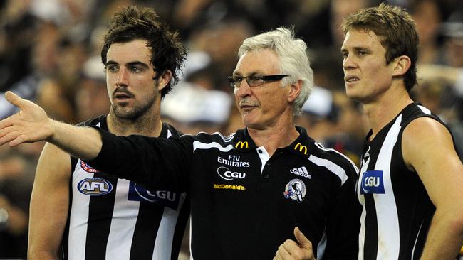 Mick Malthouse points out home truths to Steele Sidebottom and Dayne Beams.