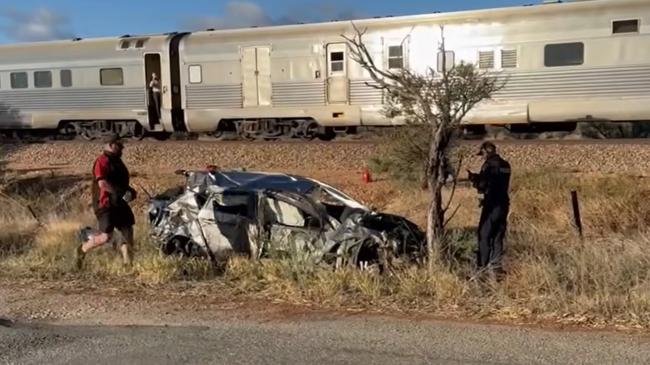 Emergency services were called to a level crossing on Park Rd, just east of the Augusta Highway, after a Mazda that had been travelling east crashed into the Ghan. Picture: 9 News