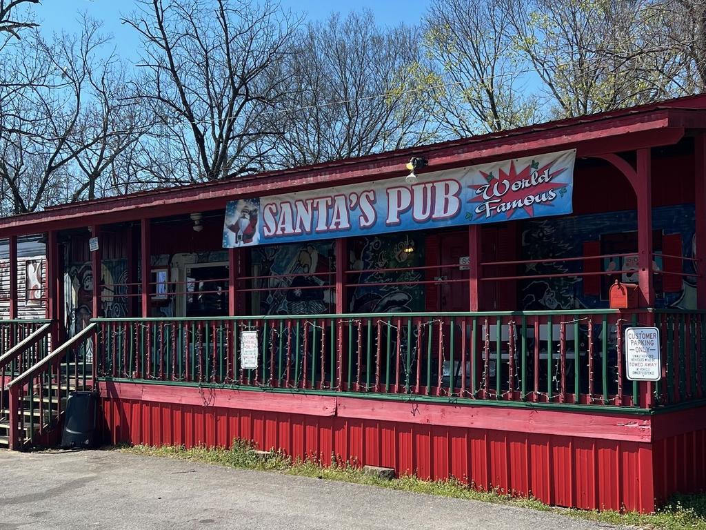 Santa’s Pub is exactly what it looks like - a double-wide trailer converted into a dive bar. The beers are cheap (but don’t ask for a cocktail). Picture: news.com.au