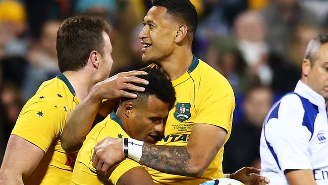 CANBERRA, AUSTRALIA - SEPTEMBER 16: Will Genia and Israel Folau of the Wallabies embrace after a try by Genia during The Rugby Championship match between the Australian Wallabies and the Argentina Pumas at Canberra Stadium on September 16, 2017 in Canberra, Australia. (Photo by Mark Nolan/Getty Images)