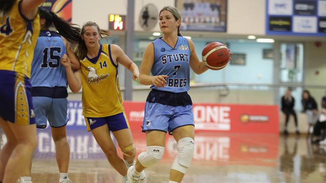 Sturt’s Jade Johnson, drives into the key ahead of Forestville’s Izzy Borlase. Picture: Dean Martin