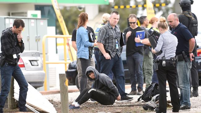 Police make an arrest at the corner of Heatherton and Stud roads in Dandenong North. Picture: Mike Keating.