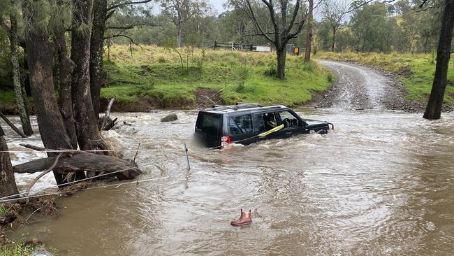 Three people were rescued by a police officer after they became trapped by floodwaters in the state’s Hunter Region yesterday. Picture: PMU