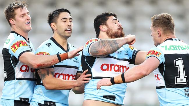 Braden Hamlin-Uele of the Sharks pretends to knock out Jack Williams (Photo by Mark Kolbe/Getty Images)