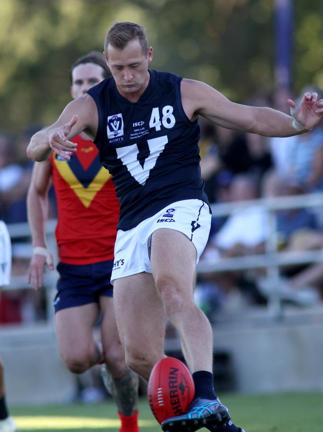 Kreuger gets a kick away for the VFL representative side. Picture: Kelly Barnes/AFL Photos/via Getty Images